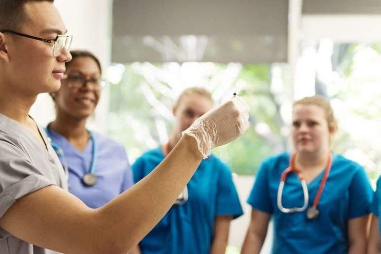 Phlebotomy Instructor Observes Student 11