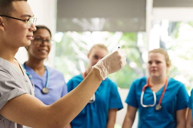 Phlebotomy Instructor Observes Student 11