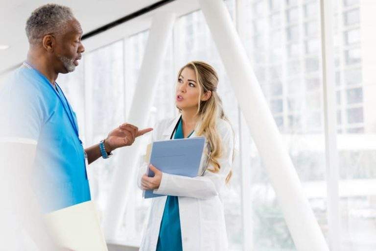 Experienced Phlebotomist Speaks With Doctor 4