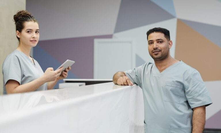 Medical office staff working together at a modern clinic reception desk
