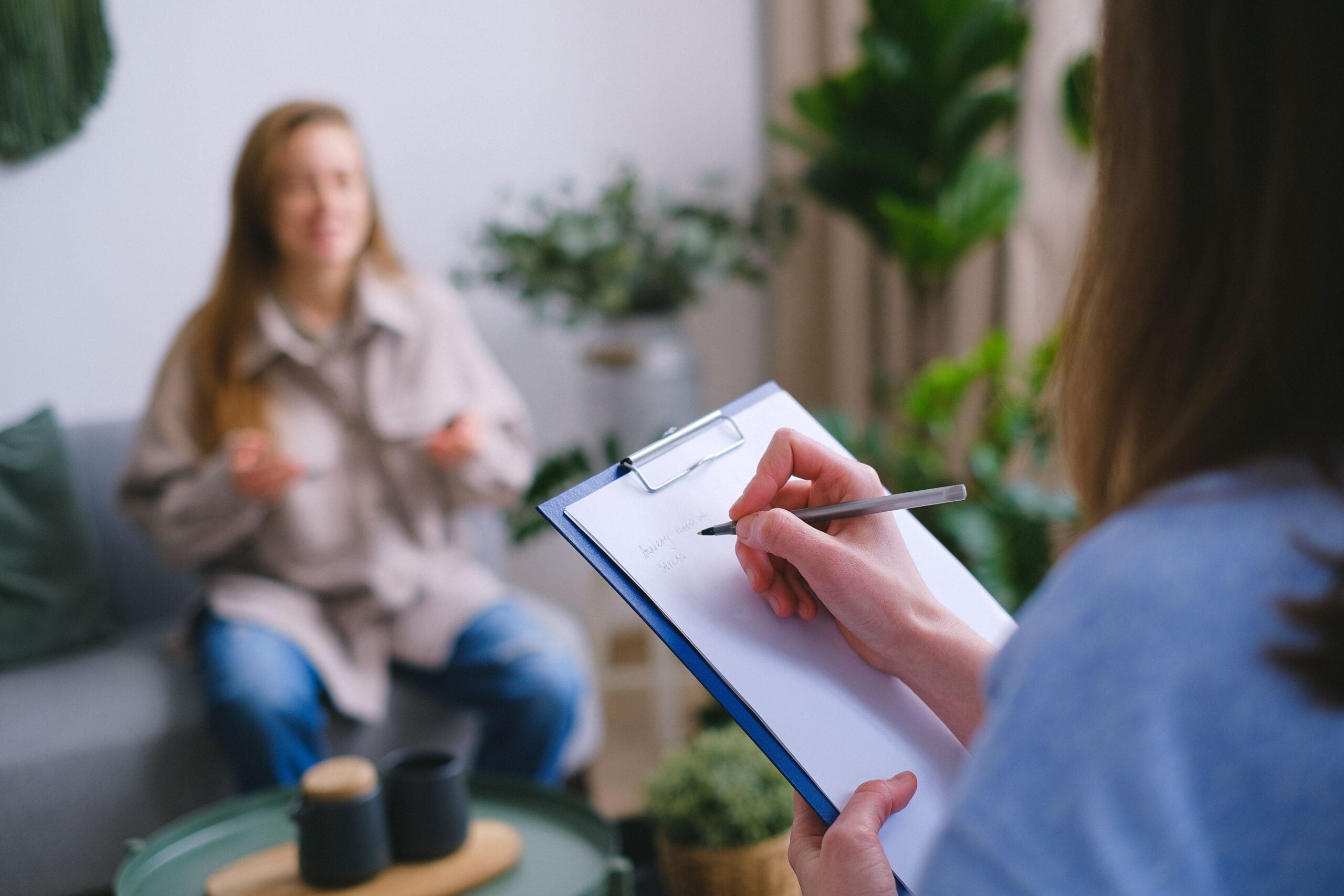 Counselor listening to a client during a behavioral health session