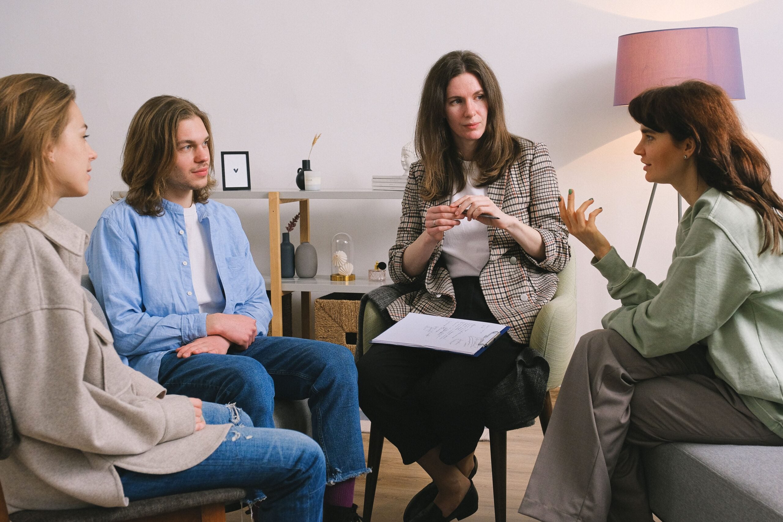 Behavioral health professional facilitating a group discussion