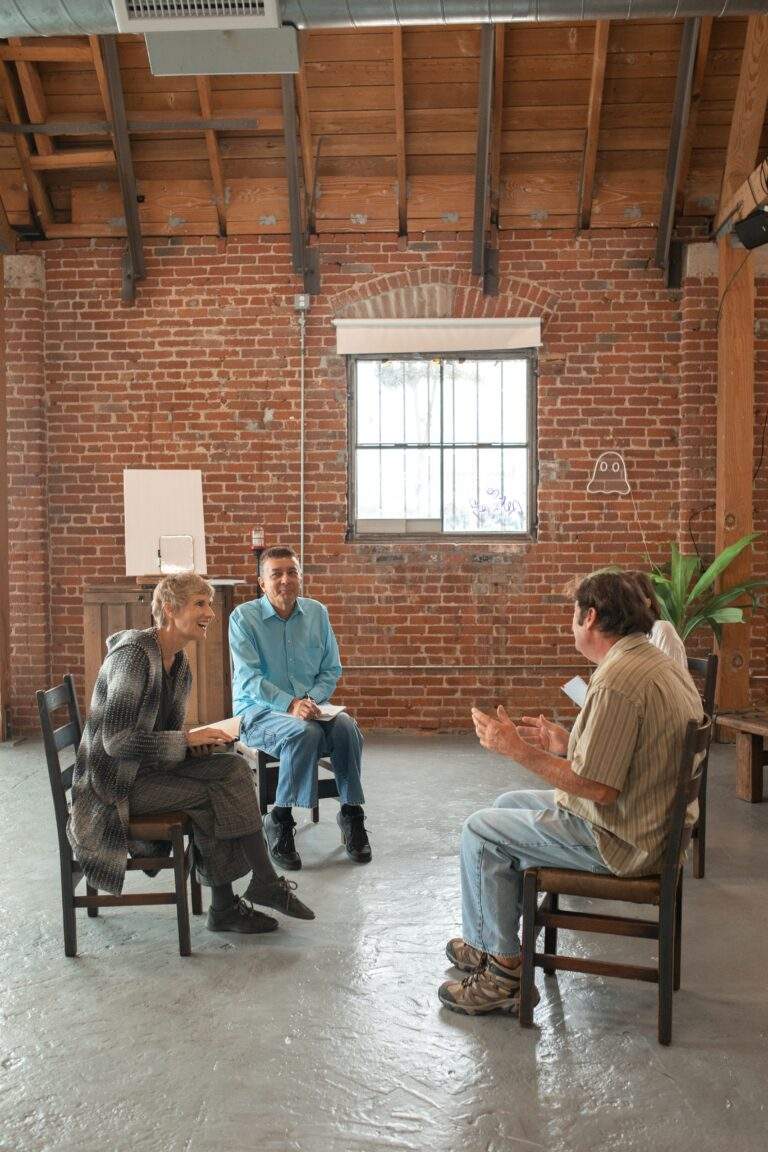 Adult learners participating in a facilitated group discussion