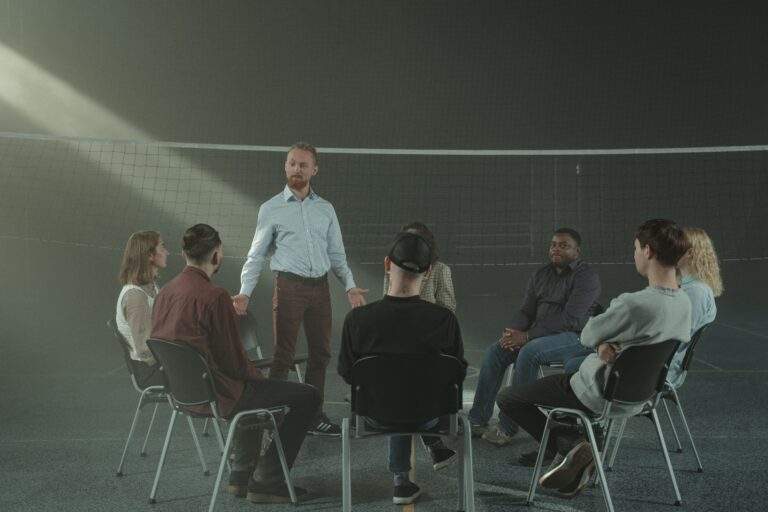 Facilitator leading a professional adult group discussion