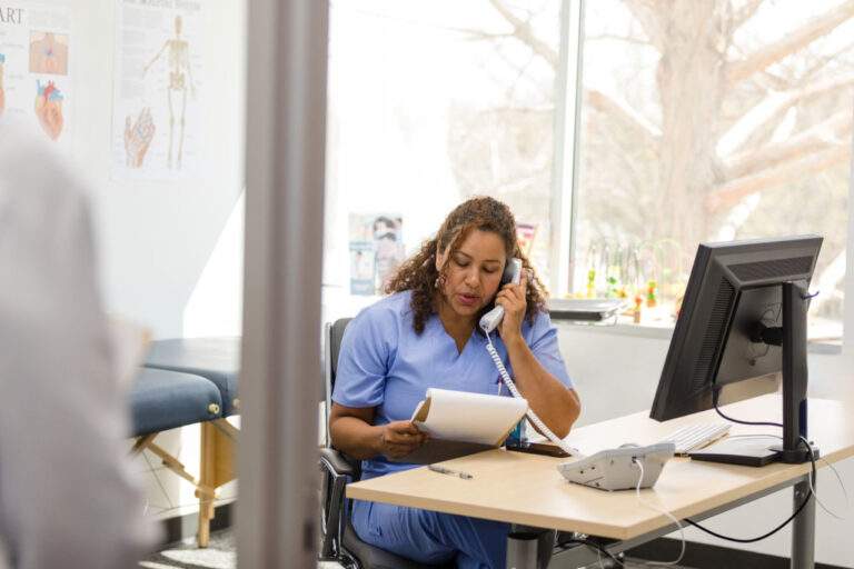 Counselor speaking with a client in a professional office