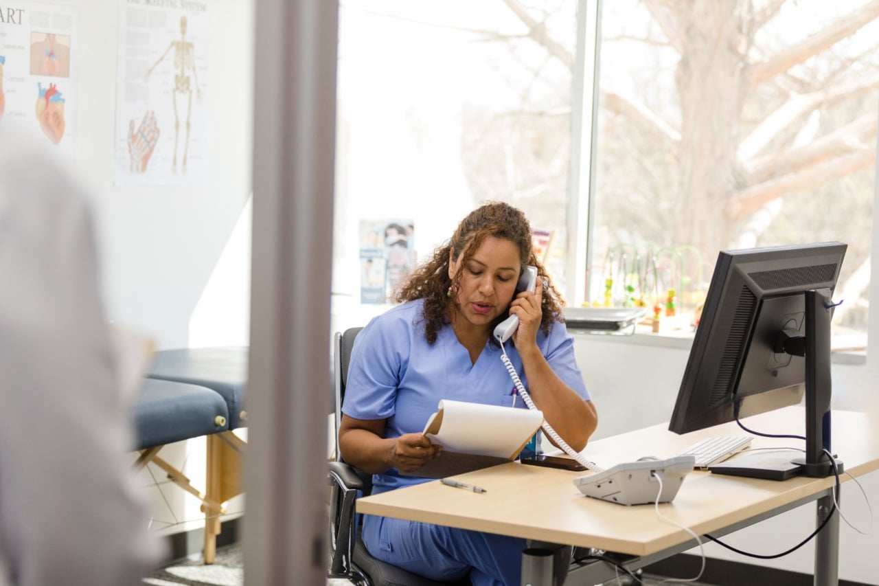 Counselor speaking with a client in a professional office